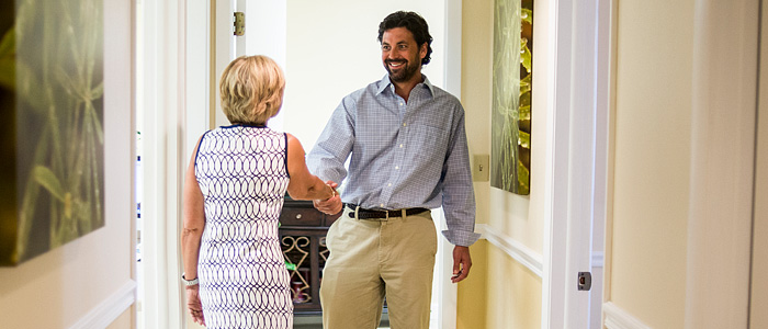 Dr. Britten greeting a patient